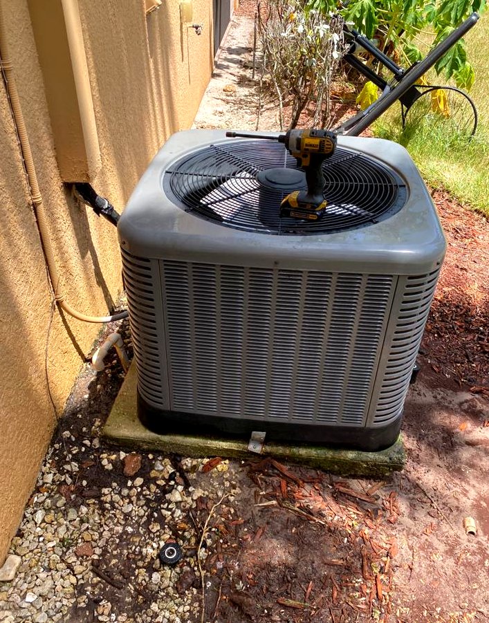 The condenser back together with the fan reinstalled, ready to restart.