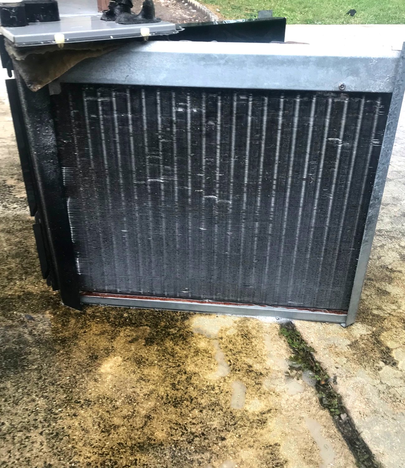 The finished coil with clean bright fins and a washed drain pan.
